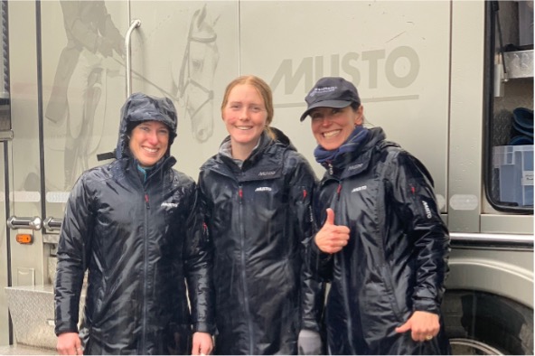 The team continue to smile through yet another wet day – Jess, Molly & Rosie