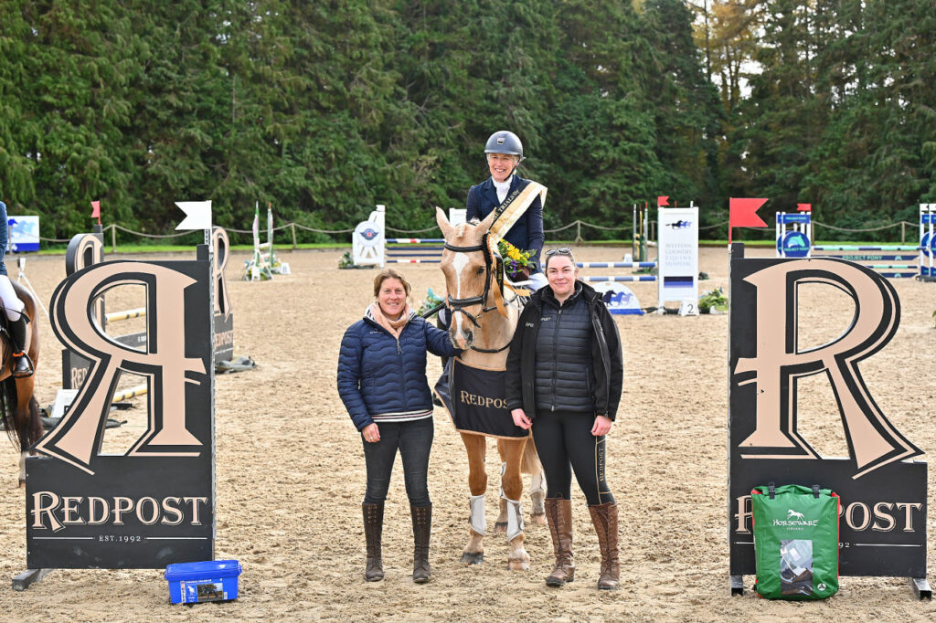 Jane Rogers and Corrieview Merlin Magic receive their prizes as winners of the Redpost Equestrian BE100. 