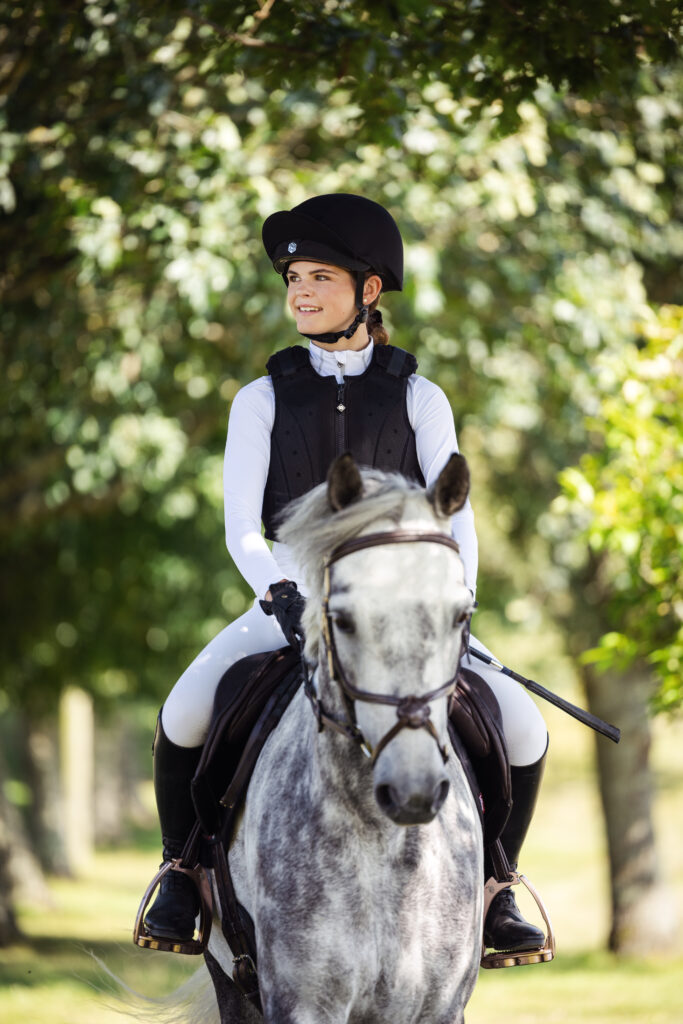 Horse and Rider. Rider is wearing the EQX Phoenix riding hat.