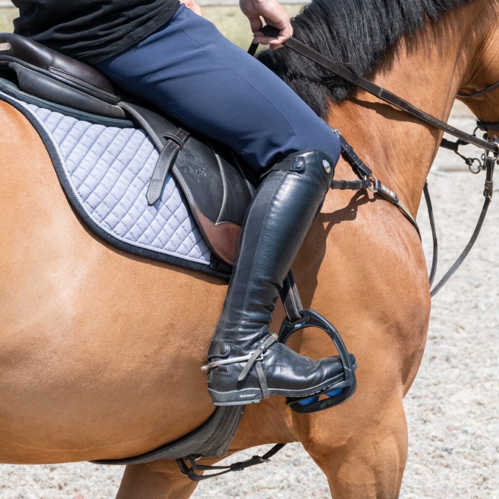 Rider wearing spurs.